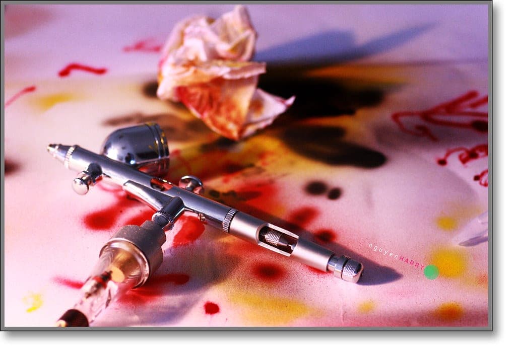 A dual-action gravity-feed airbrush with paint cup