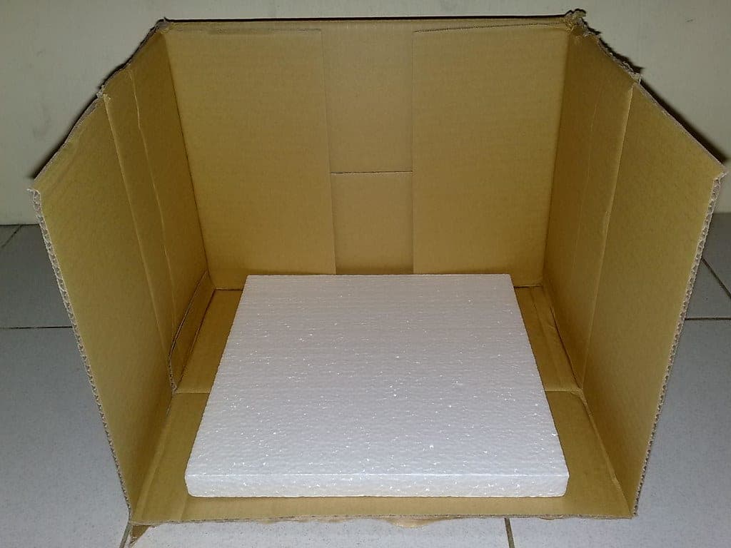 A portable spray booth with an extraction hose