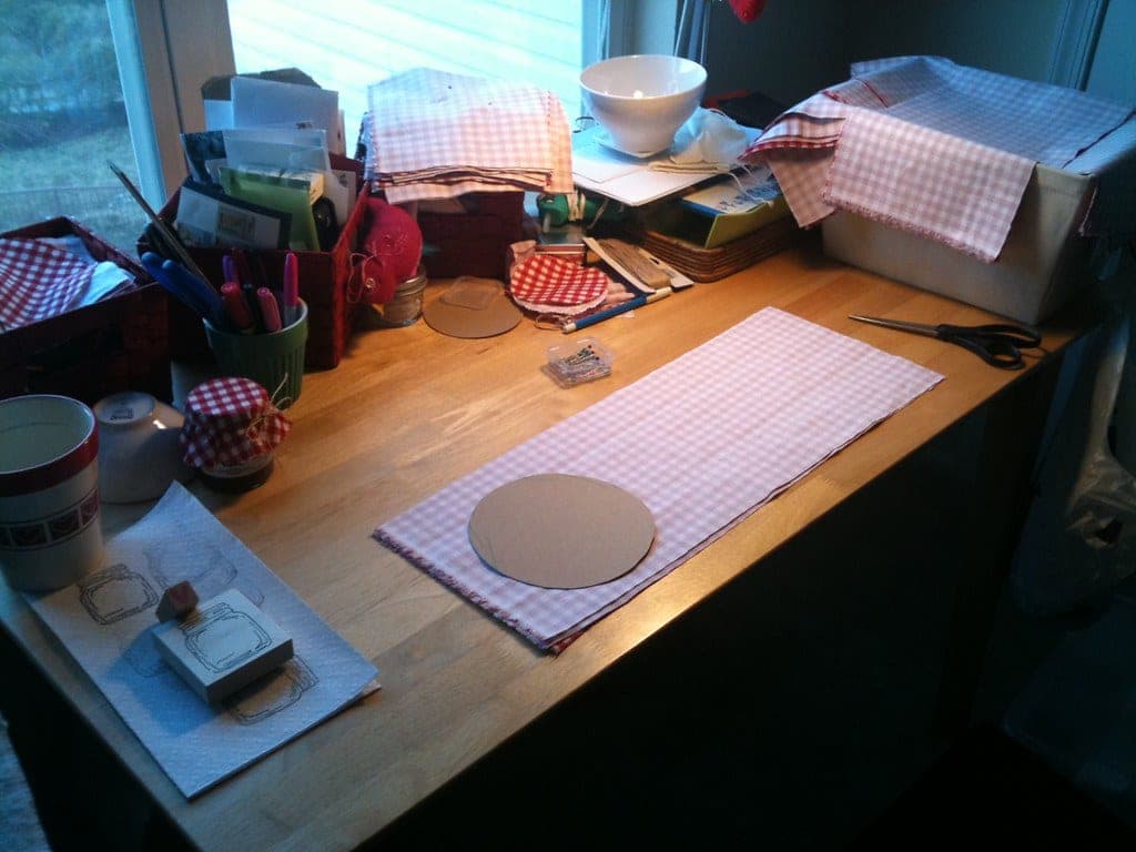 A primer bottle and brush on a desk