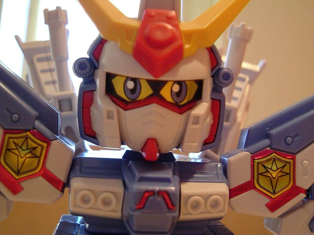 A Gundam model kit being detailed